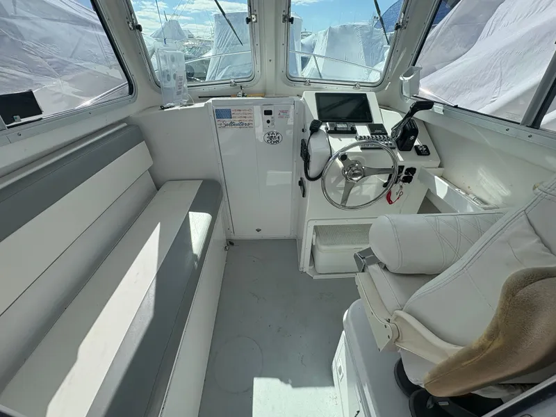 Slide: The Image of Interior of a 2019 Steiger Craft 23 Chesapeke boat with helm console. - 4