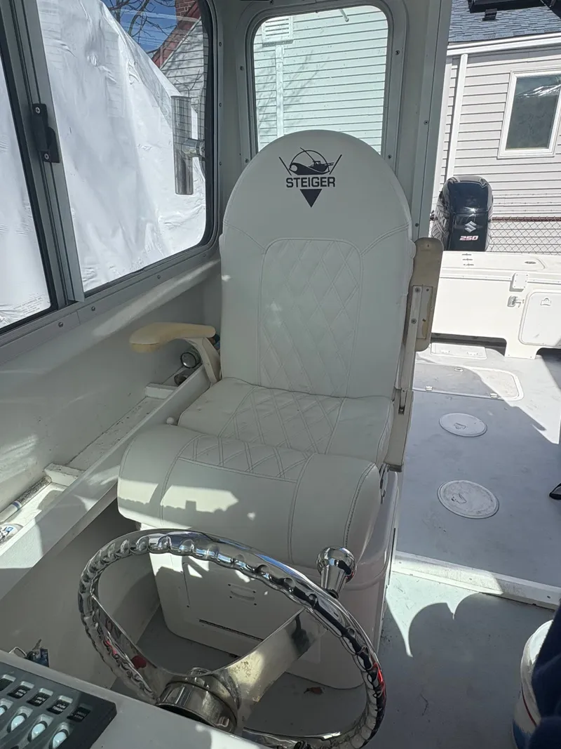 Slide: The Image of Interior of a 2019 Steiger Craft 23 Chesapeke boat with steering seat. - 6