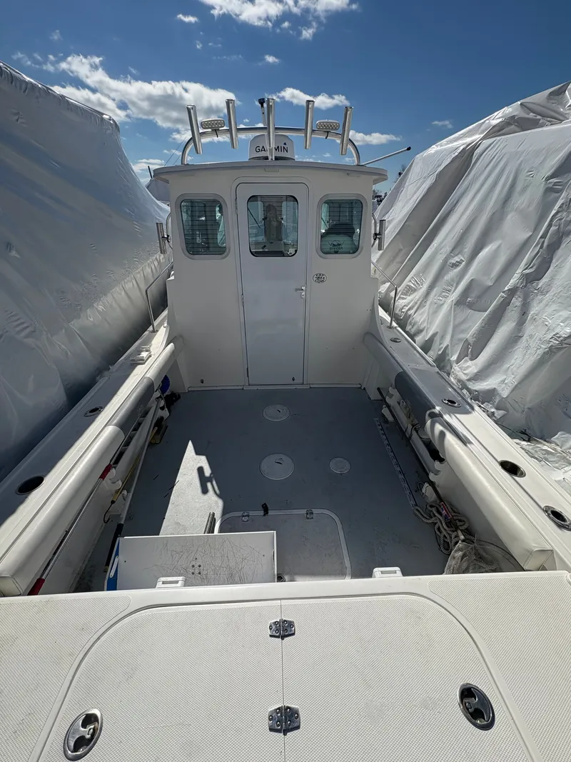Slide: The Image of 2019 Steiger Craft 23 Chesapeke boat interior view, blue sky. - 9