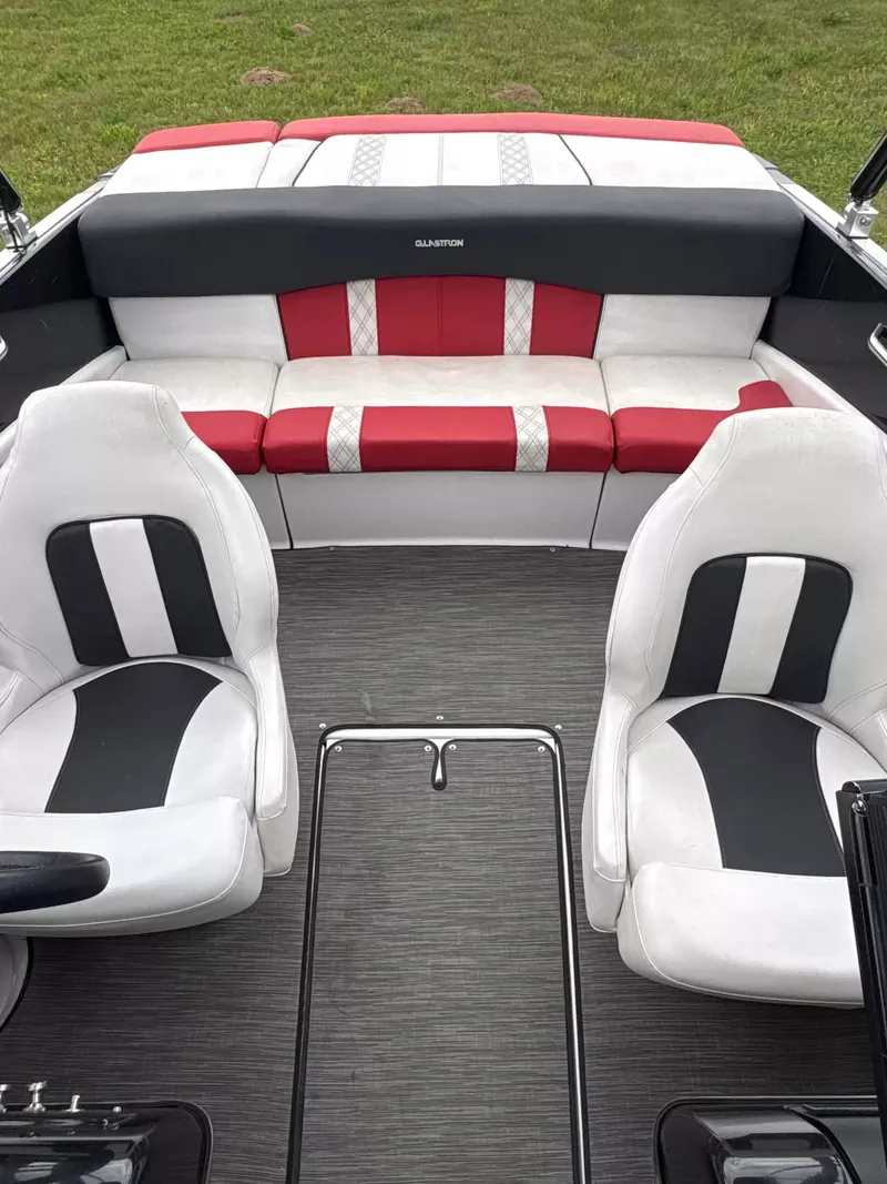 Slide: The Image of Interior view of a 2019 Glastron GTS185 boat with stylish seating and modern design. - 4