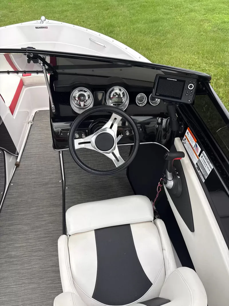 Slide: The Image of The image shows the cockpit of a 2019 Glastron GTS185 with a modern dashboard. - 6