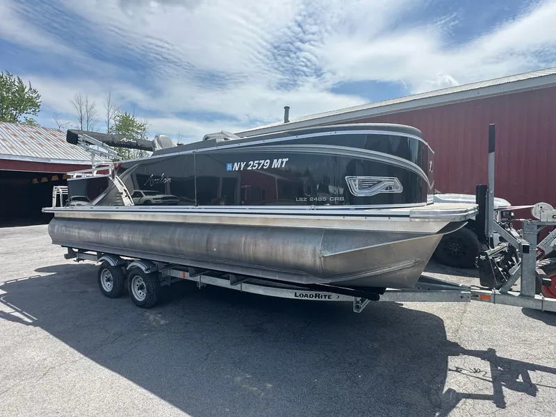 The Image of 2022 Avalon LSZ Cruise pontoon boat on trailer, side view. - 1