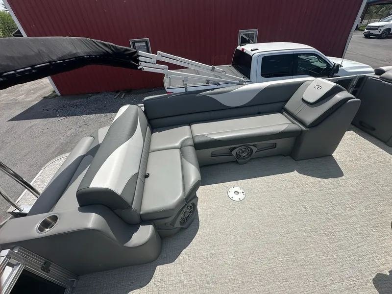 Slide: The Image of 2022 Avalon LSZ Cruise boat with gray seating and carpeted floor. - 11