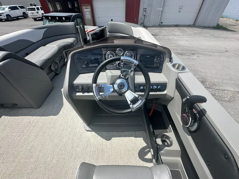Slide: The Image of Interior of a 2022 Avalon LSZ Cruise boat with steering console. - 13