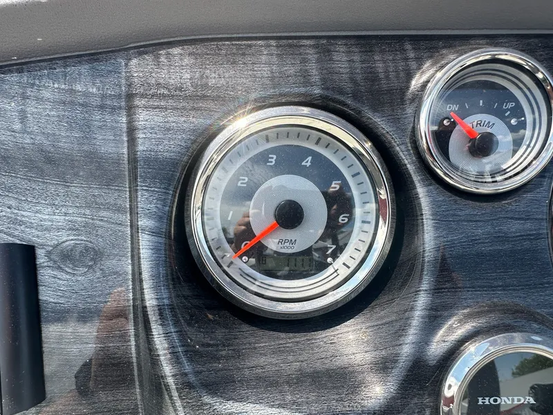 Slide: The Image of Tachometer and trim gauge on 2022 Avalon LSZ Cruise. - 15