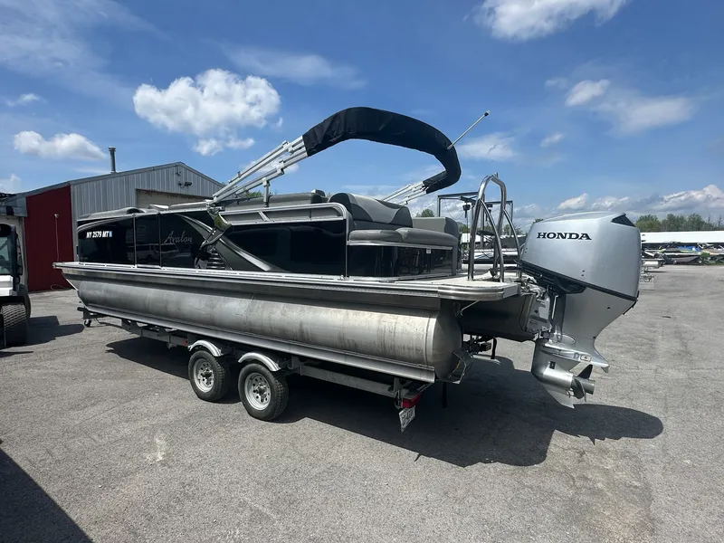 Slide: The Image of 2022 Avalon LSZ Cruise pontoon boat with Honda engine on trailer. - 6