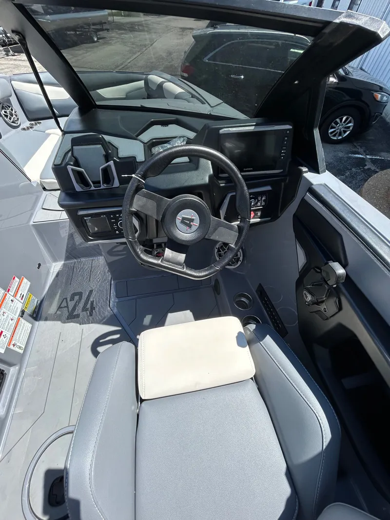 Slide: The Image of Interior of 2023 Axis A24 boat with steering console. - 10