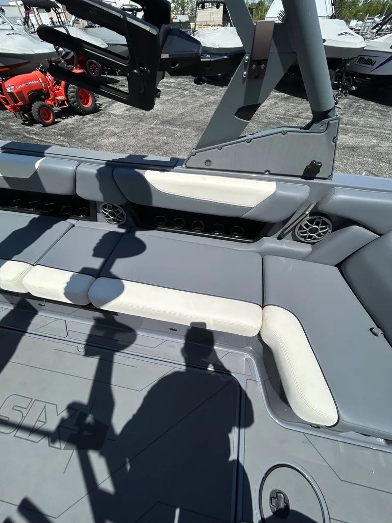 Slide: The Image of Interior of a 2023 Axis A24 boat with gray and white seating. - 13