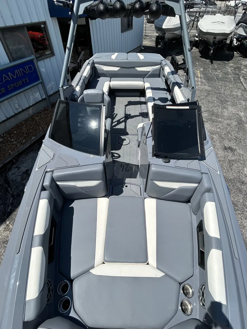 Slide: The Image of Interior view of a 2023 Axis A24 boat with gray seating. - 19