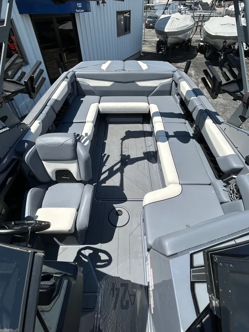 Slide: The Image of Interior of a 2023 Axis A24 boat with gray seating. - 20