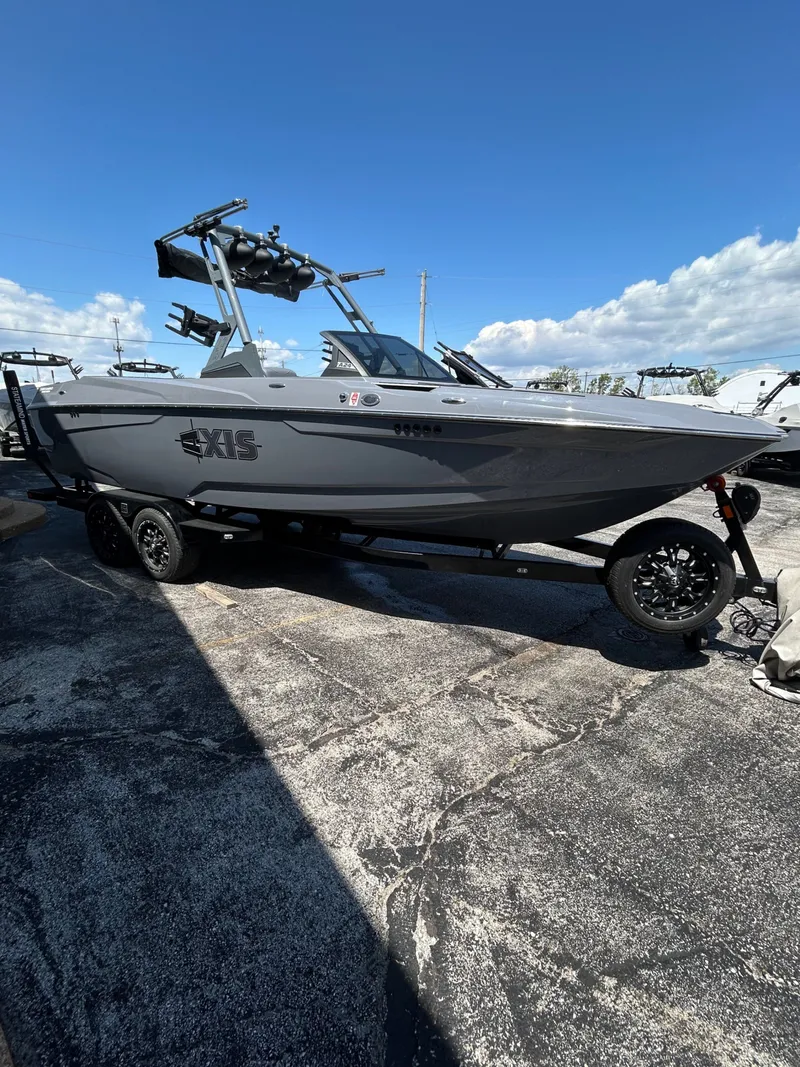 Slide: The Image of 2023 Axis A24 boat on trailer under blue sky. - 5