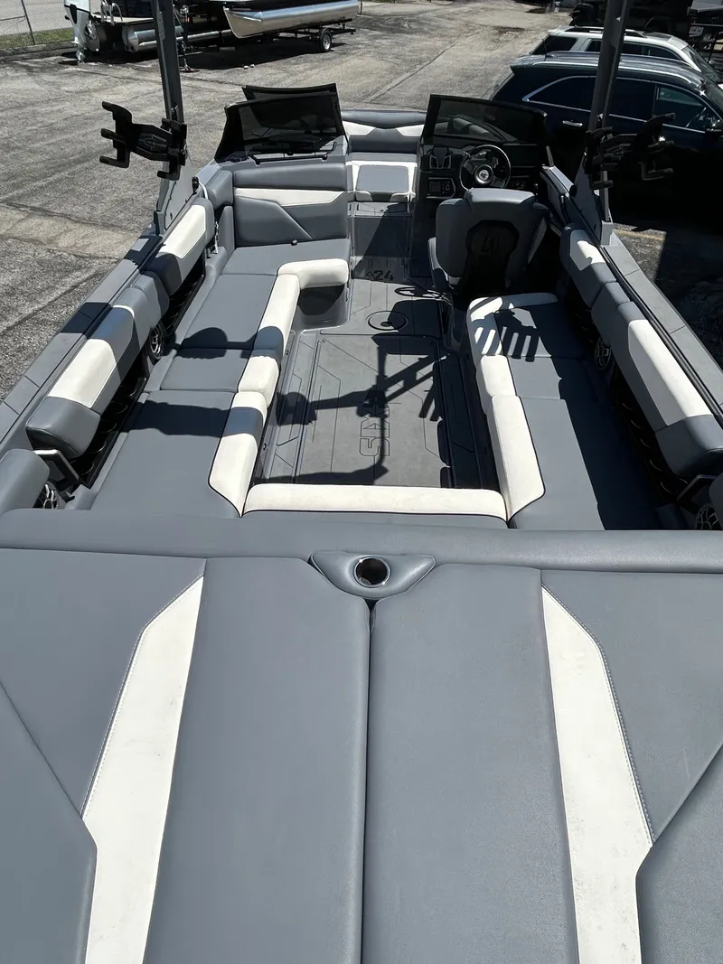 Slide: The Image of Interior of 2023 Axis A24 boat with gray and white seating. - 8