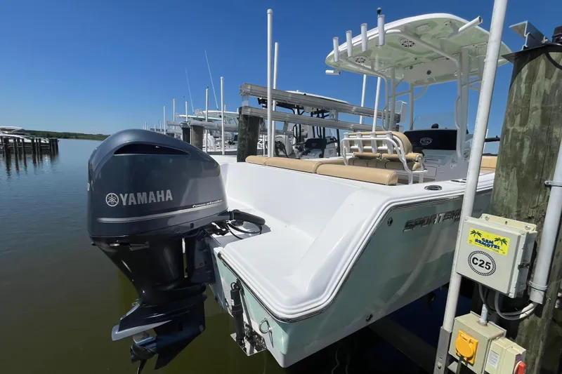 Slide: The Image of 2021 Sportsman Heritage 231 Center Console boat with Yamaha engine docked at marina. - 3
