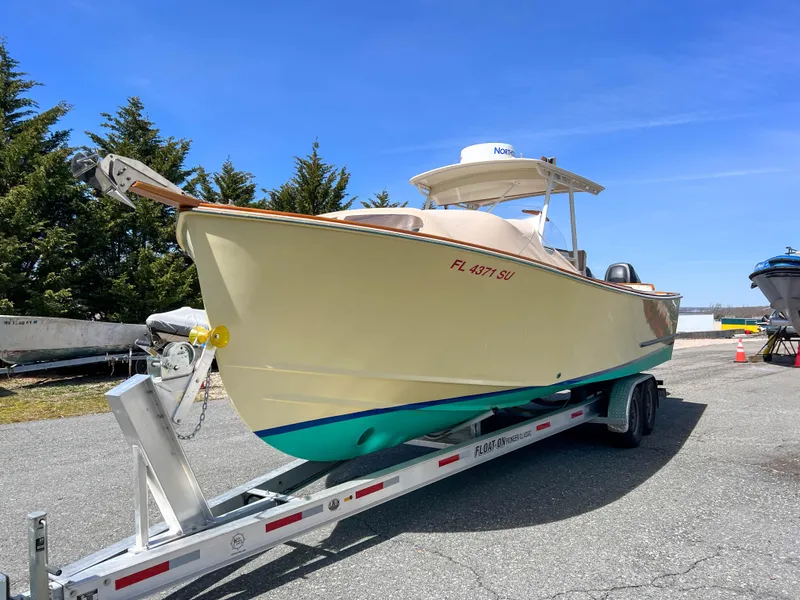 Slide: The Image of 2003 Padebco V27 Center Console boat on trailer, sunny day, outdoor setting. - 10
