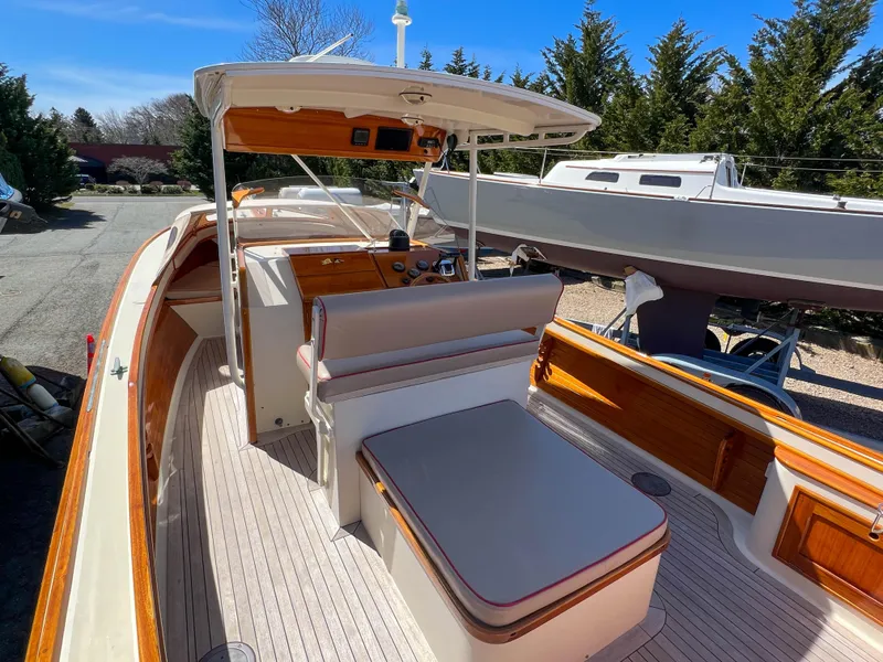 Slide: The Image of 2003 Padebco V27 Center Console boat with wooden accents and spacious seating. - 13