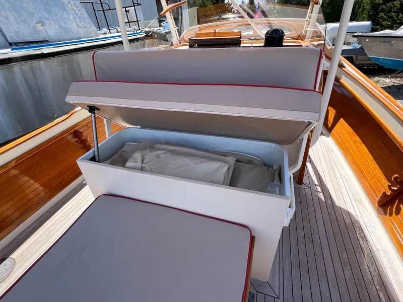Slide: The Image of 2003 Padebco V27 Center Console boat with open storage compartment on deck. - 31