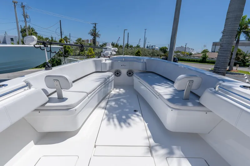 Slide: The Image of 2024 Contender 35 ST boat interior with white seating and modern design. - 10
