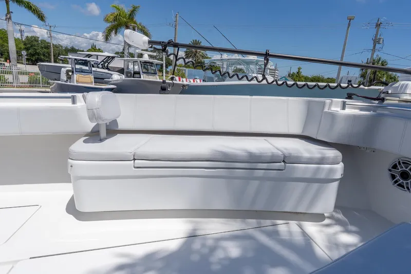 Slide: The Image of 2024 Contender 35 ST boat interior with white seating and fishing equipment. - 12