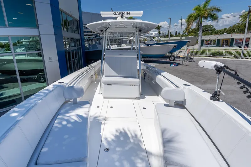 Slide: The Image of 2024 Contender 35 ST boat with sleek white interior and advanced Garmin navigation. - 13