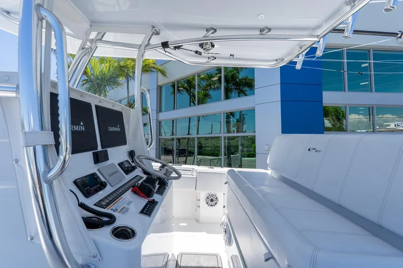 Slide: The Image of 2024 Contender 35 ST boat interior with modern controls and seating, showcasing sleek design. - 16