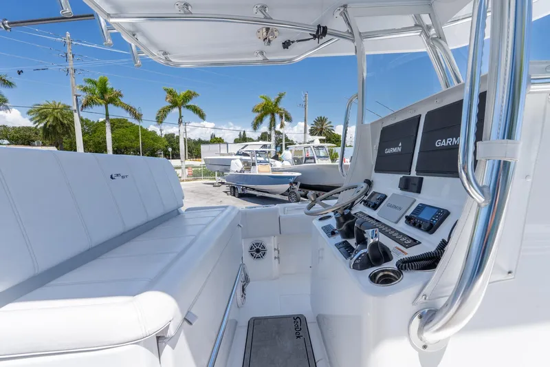 Slide: The Image of 2024 Contender 35 ST boat interior with advanced Garmin navigation system and sleek design. - 17
