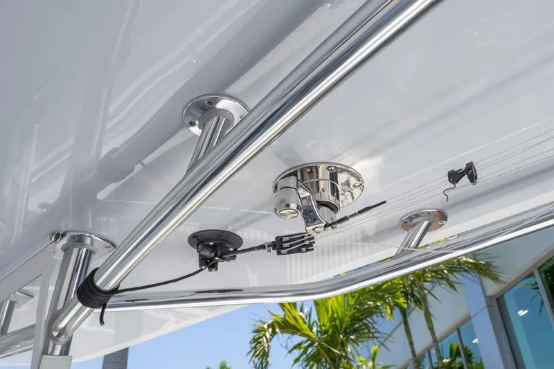 Slide: The Image of 2024 Contender 35 ST boat with stainless steel fittings and wiring under the canopy. - 19