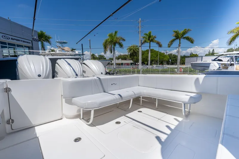 Slide: The Image of 2024 Contender 35 ST boat with spacious seating and triple Yamaha engines. - 29