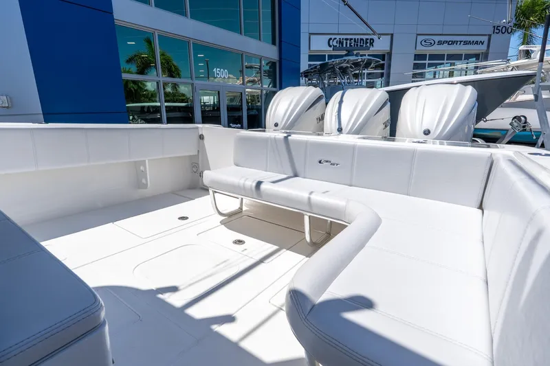 Slide: The Image of 2024 Contender 35 ST boat interior with seating and triple outboard engines. - 30
