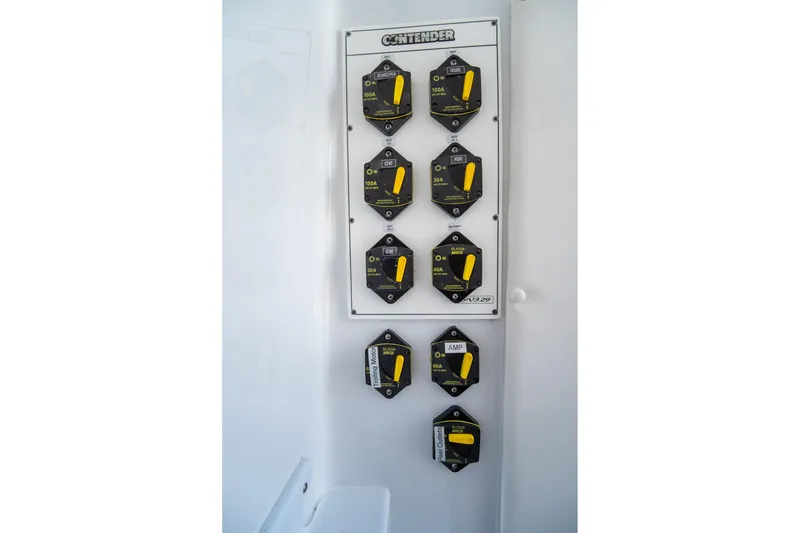 Slide: The Image of Electrical panel of 2024 Contender 35 ST boat with labeled switches and controls. - 32