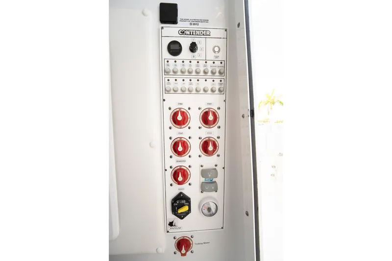 Slide: The Image of Control panel of 2024 Contender 35 ST boat with switches and dials. - 33
