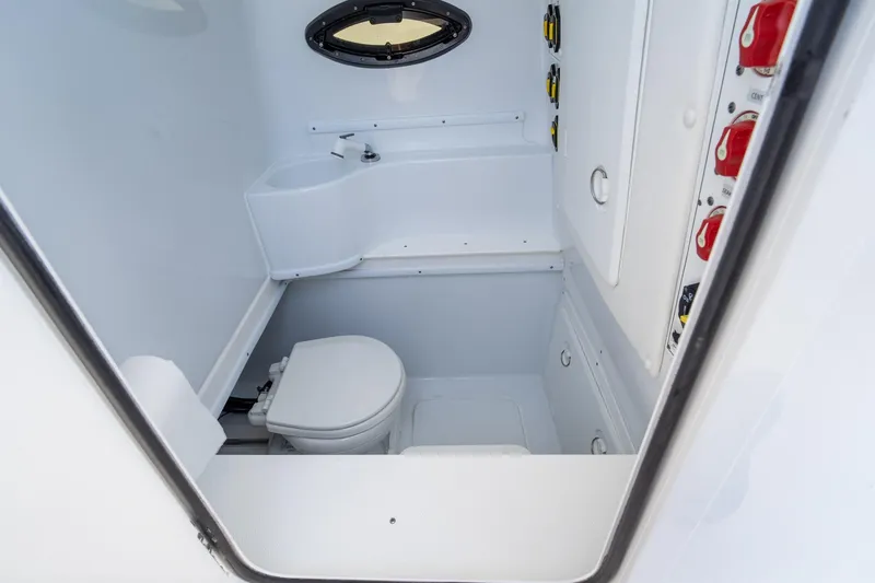 Slide: The Image of 2024 Contender 35 ST boat interior with compact bathroom and modern fixtures. - 34
