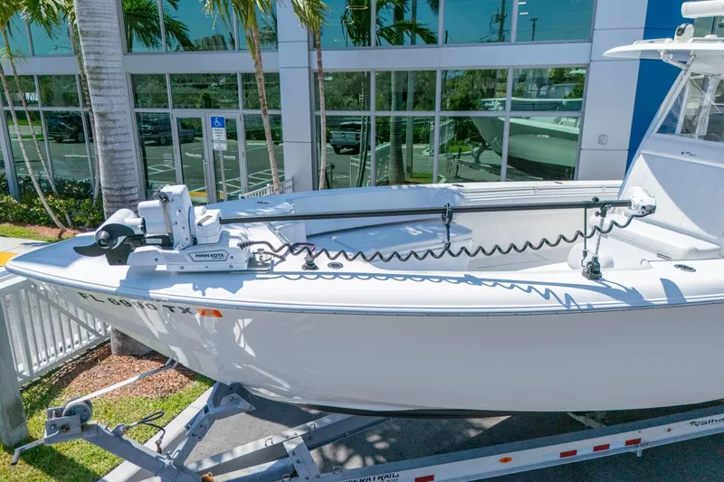 Slide: The Image of 2024 Contender 35 ST boat on trailer, equipped with Minn Kota trolling motor. - 5
