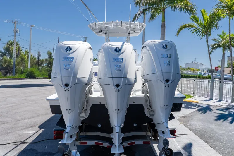 Slide: The Image of 2024 Contender 35 ST boat with triple Yamaha 300 V6 outboard engines. - 7