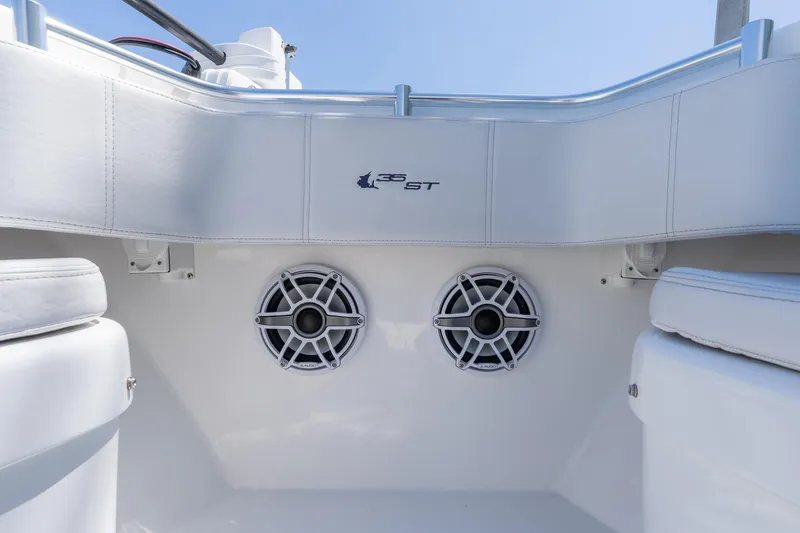 Slide: The Image of 2024 Contender 35 ST boat interior with dual speakers and white seating. - 9