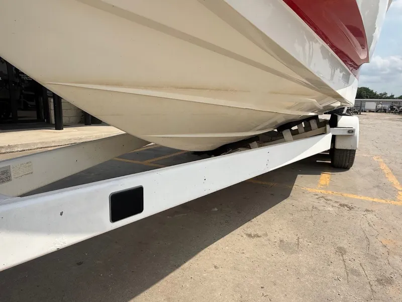 Slide: The Image of 2019 Centurion Ri257 boat on trailer, side view. - 15