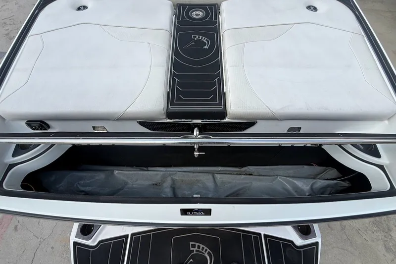 Slide: The Image of 2019 Centurion Ri257 boat rear view with storage compartment. - 18