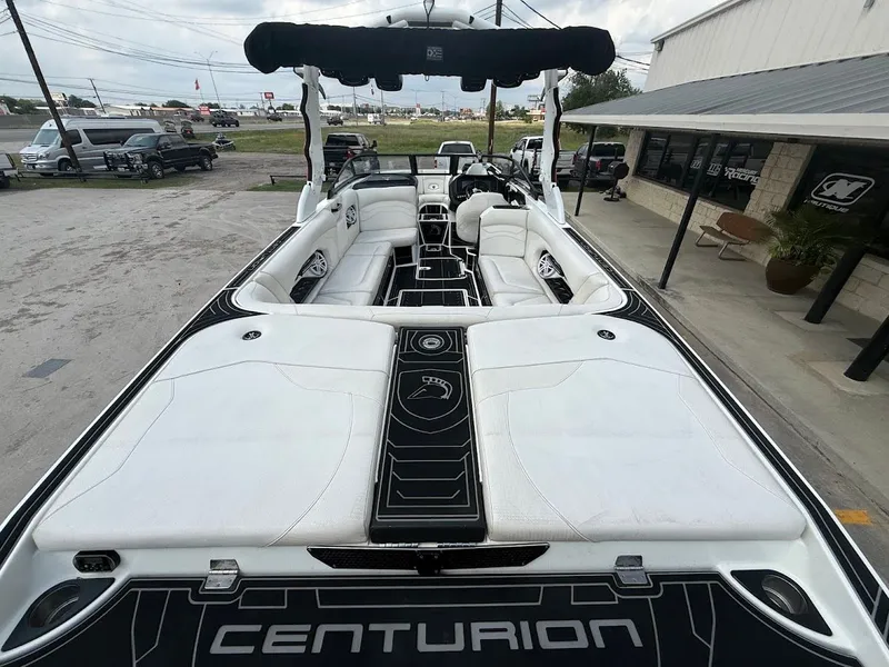 Slide: The Image of Interior view of a 2019 Centurion Ri257 boat with white seating. - 19