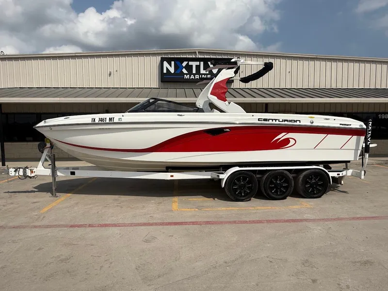 Slide: The Image of 2019 Centurion Ri257 boat on trailer at NXT LVL Marine. - 2