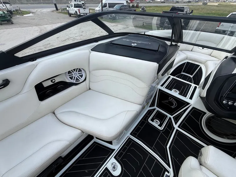 Slide: The Image of Interior of a 2019 Centurion Ri257 boat with white seating. - 23