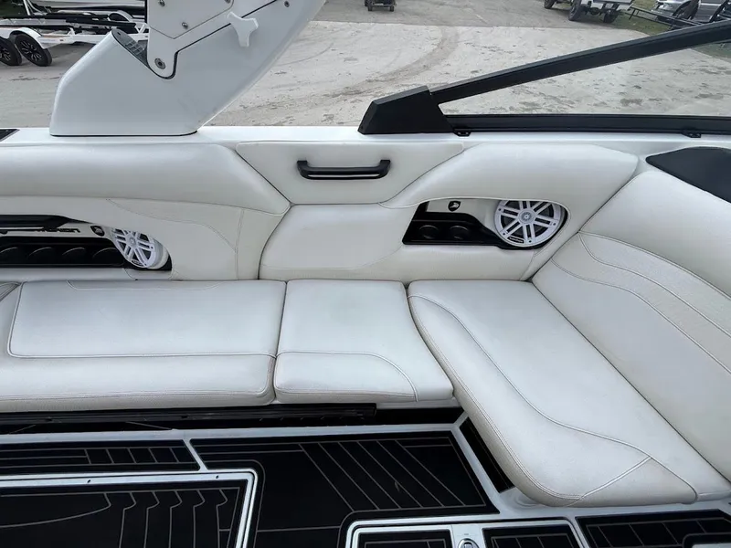 Slide: The Image of Interior of a 2019 Centurion Ri257 boat with white leather seating. - 24