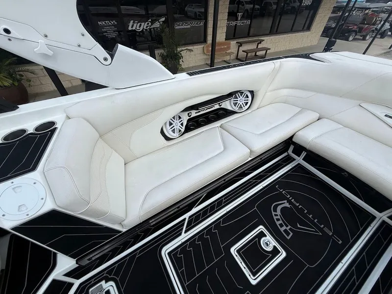 Slide: The Image of Interior of a 2019 Centurion Ri257 boat with white seating. - 27