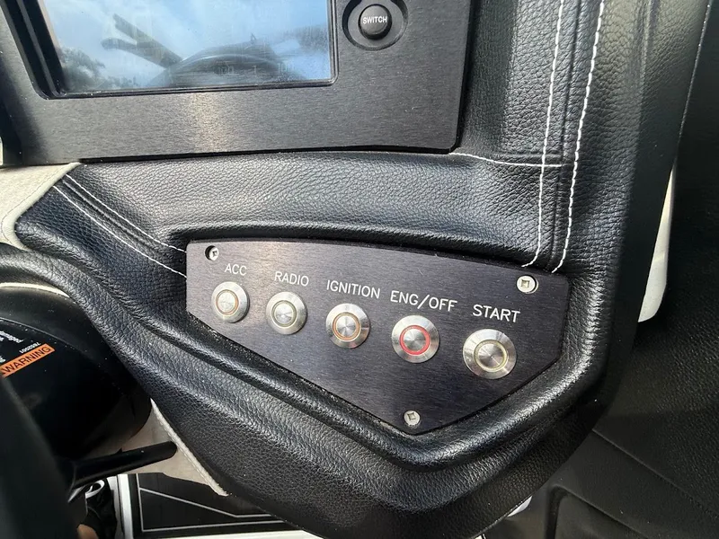 Slide: The Image of Dashboard of a 2019 Centurion Ri257 boat with control buttons. - 31