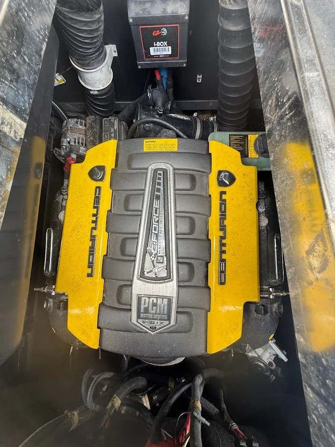 Slide: The Image of Engine of 2019 Centurion Ri257 boat, yellow cover, PCM branding. - 43