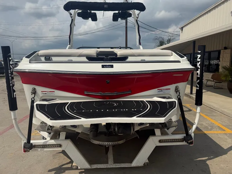 Slide: The Image of Rear view of a 2019 Centurion Ri257 boat in a parking lot. - 7