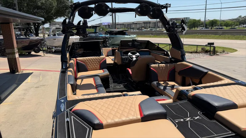 Slide: The Image of Interior view of 2024 Tigé 24RZX boat with luxurious seating. - 11