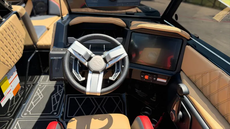 Slide: The Image of 2024 Tigé 24RZX interior with modern steering wheel and touchscreen display. - 20