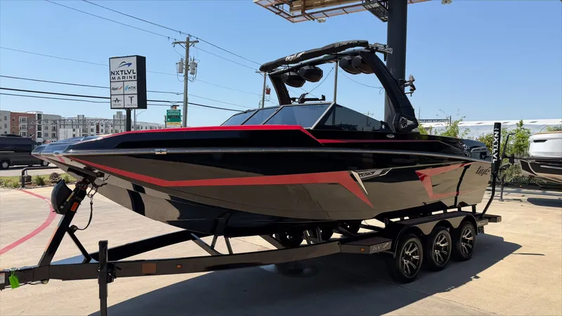 Slide: The Image of 2024 Tigé 24RZX boat on trailer at NXT LVL Marine. - 8