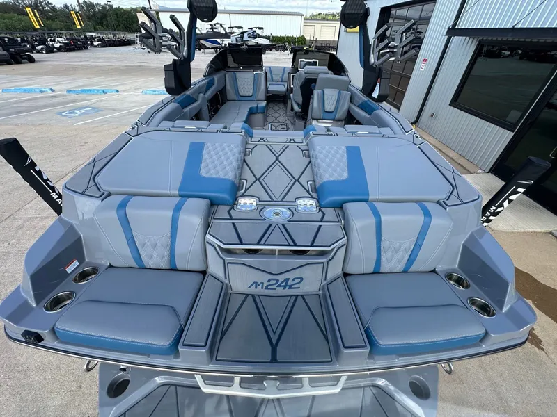 Slide: The Image of 2024 Malibu M242 boat with luxurious interior design. - 10
