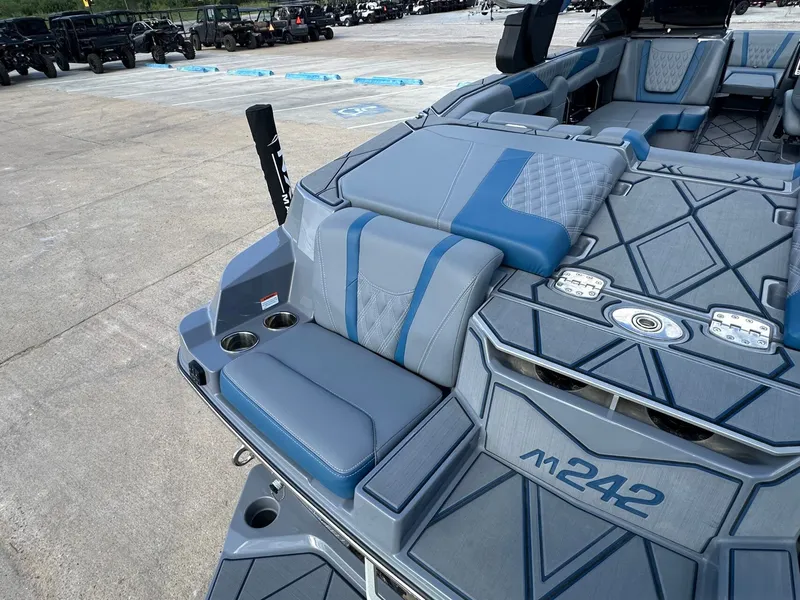 Slide: The Image of 2024 Malibu M242 boat featuring luxurious interior design. - 11