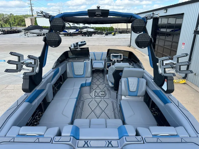 Slide: The Image of Interior of 2024 Malibu M242 boat with luxurious seating and features. - 13